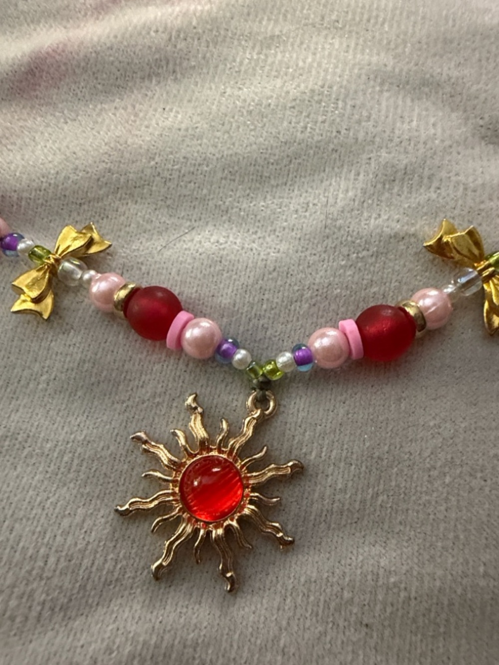 Handcrafted Pink & Red Beaded Sun Pendant Necklace by Vesperanza